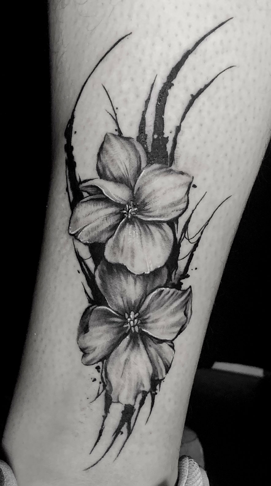 small blackwork flower with abstract elements